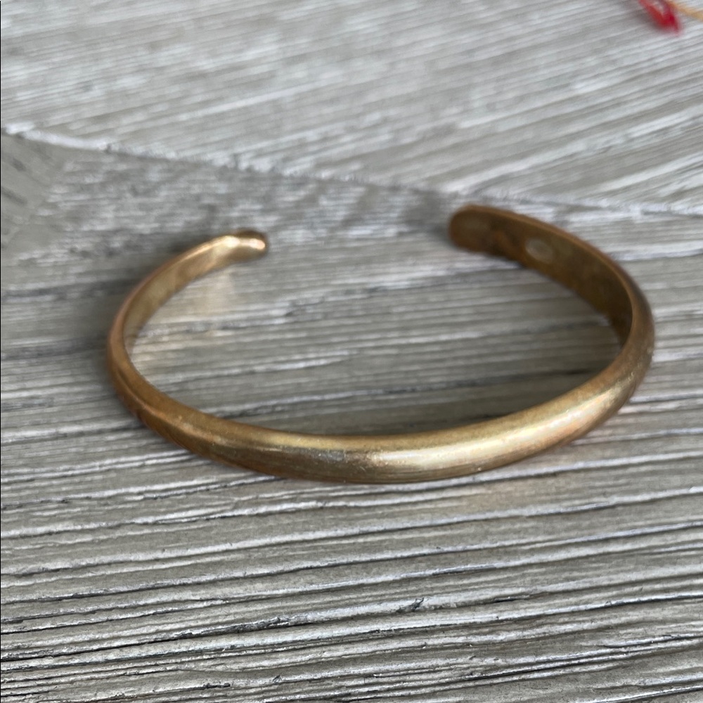 Alex and Ani, “Higher Power” Gold Bangle Bracelet.